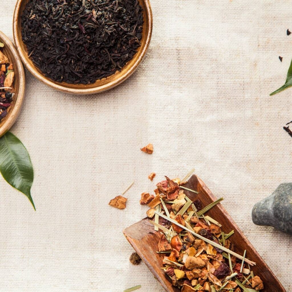 A table with herbs and bottles of medicine.